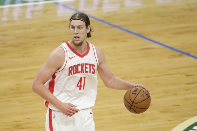 Houston Rockets' Kelly Olynyk dribbles during the first half of an NBA basketball game against the Milwaukee Bucks Friday, May 7, 2021, in Milwaukee. (AP Photo/Aaron Gash)