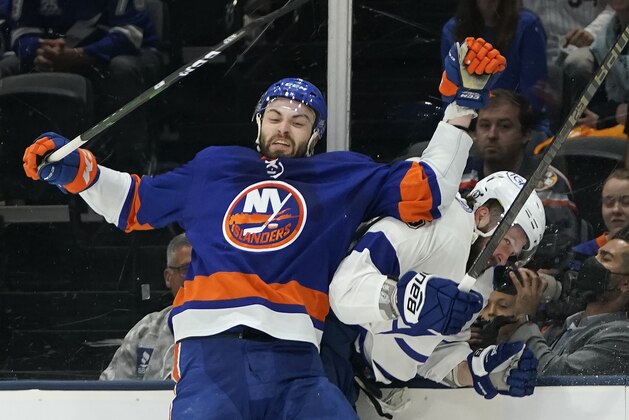 New York Islanders defenseman Adam Pelech (3) collides with Tampa Bay Lightning right wing Nikita Kucherov (86) during the first period of Game 3 of the NHL hockey Stanley Cup semifinals, Thursday, June 17, 2021, in Uniondale, N.Y. (AP Photo/Frank Franklin II)