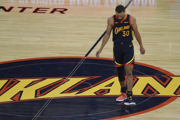 Golden State Warriors' Stephen Curry looks down at the court during the second half of an NBA basketball Western Conference play-in game against Memphis Grizzlies in San Francisco, Friday, May 21, 2021. (AP Photo/Jed Jacobsohn)