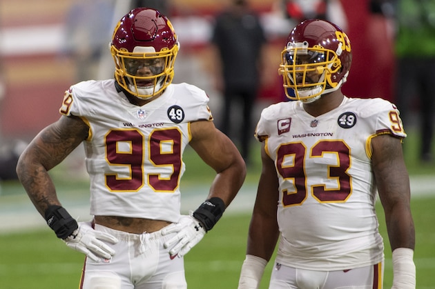 Washington Football Team defensive end Chase Young (99) talks with defensive tackle Jonathan Allen (93) during an NFL football game against the San Francisco 49ers, Sunday, Dec. 13, 2020, in Glendale, Ariz. (AP Photo/Jennifer Stewart)