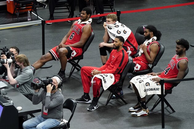Chicago Bulls players watch during the second half of an NBA basketball game against the Milwaukee Bucks in Chicago, Sunday, May 16, 2021. (AP Photo/Nam Y. Huh)