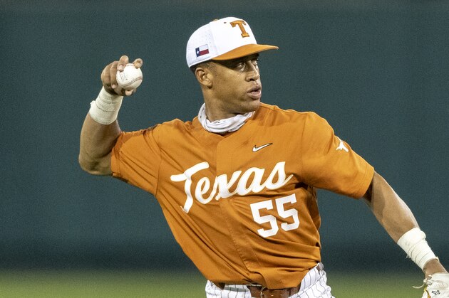 Texas third baseman Cam Williams makes a throw to first in warm ups as the Longhorns take the field against Nevada during an NCAA baseball game on Tuesday, April 13, 2021, in Austin, Texas. (AP Photo/Stephen Spillman)