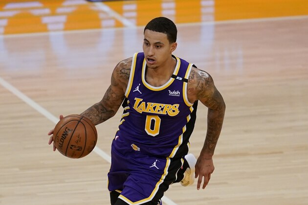 Los Angeles Lakers forward Kyle Kuzma (0) controls the ball during an NBA basketball game against the New York Knicks Tuesday, May 11, 2021, in Los Angeles. (AP Photo/Ashley Landis)