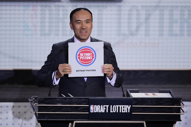 FILE - In this May 16, 2017, file photo, NBA Deputy Commissioner Mark Tatum announces the results for the Detroit Pistons at the NBA basketball draft lottery in New York. Deputy Commissioner Mark A diversity report shows the NBA “significantly ahead” again in professional sports in racial and gender hiring practices. Tatum is the highest ranking African-American of any of the professional American sports leagues.  (AP Photo/Frank Franklin II, File