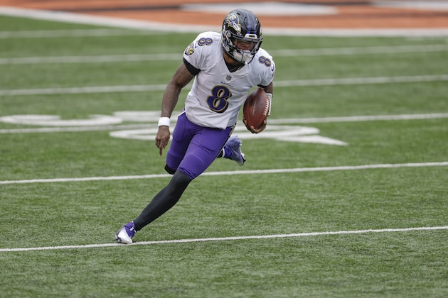 CINCINNATI, OHIO - JANUARY 03: Lamar Jackson #8 of the Baltimore Ravens scrambles with the ball during the game against the Cincinnati Bengals at Paul Brown Stadium on January 03, 2021 in Cincinnati, Ohio. (Photo by Michael Hickey/Getty Images)