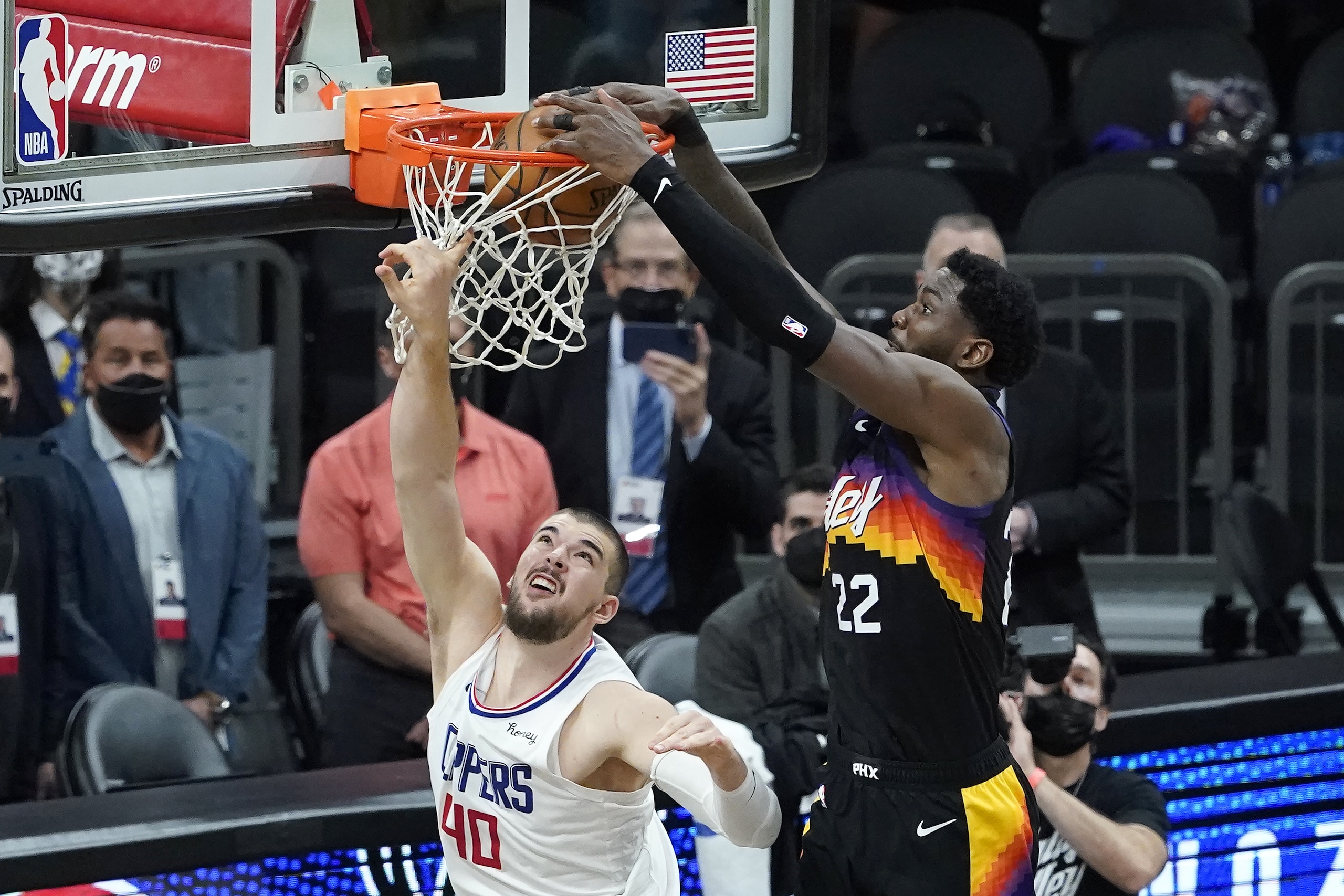 Phoenix Suns center Deandre Ayton, right, scores over Los Angeles Clippers center Ivica Zubac during the second half of Game 2 of the NBA basketball Western Conference Finals, Tuesday, June 22, 2021, in Phoenix. (AP Photo/Matt York)