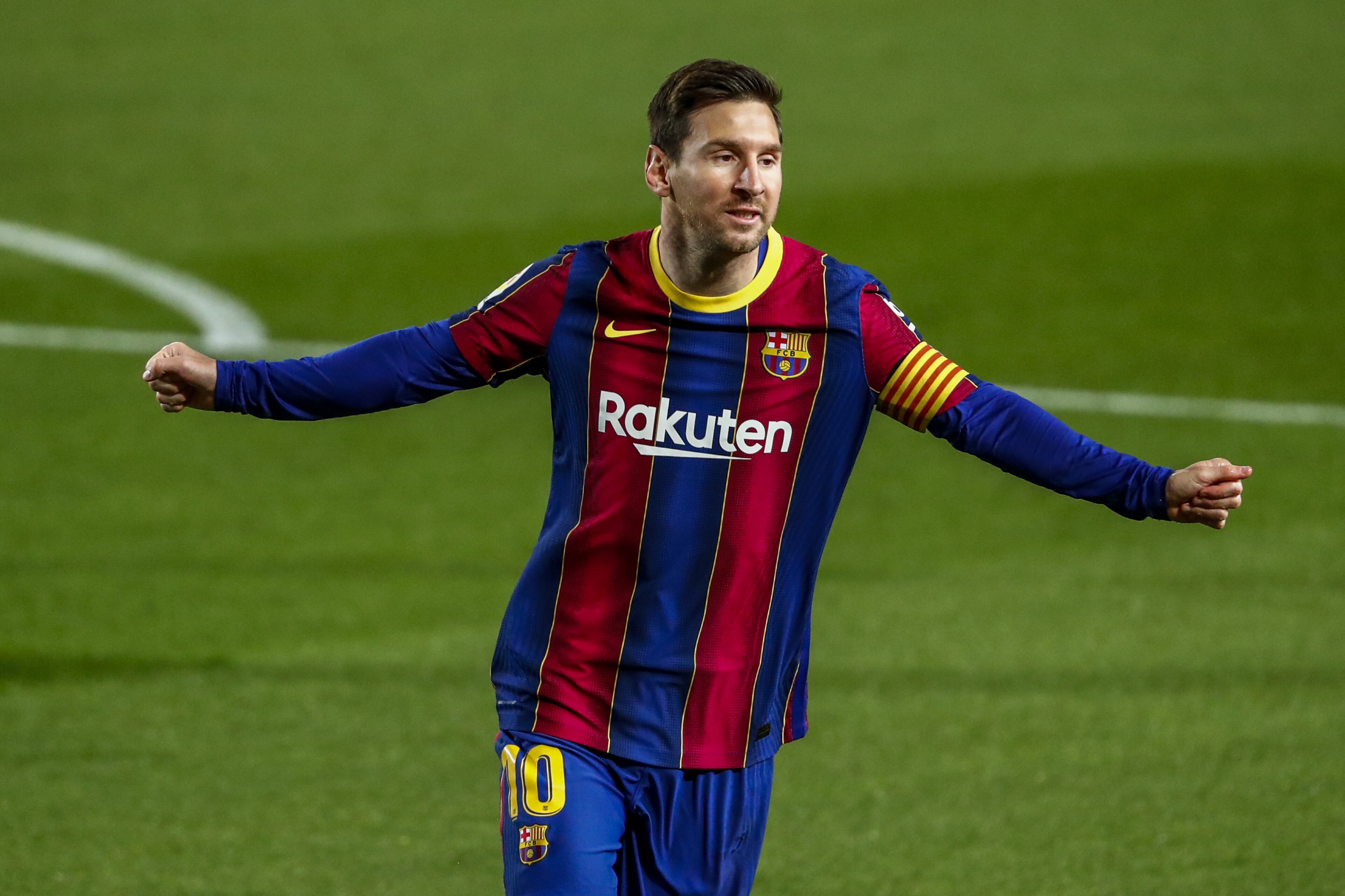 Barcelona's Lionel Messi celebrates after scoring the opening goal during the Spanish La Liga soccer match between FC Barcelona and Getafe at the Camp Nou stadium in Barcelona, Spain, Thursday, April 22, 2021. (AP Photo/Joan Monfort)