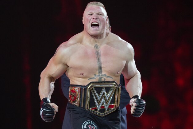 FILE - In this March 29, 2015, file photo, Brock Lesnar makes his entrance at Wrestlemania XXXI in Santa Clara, Calif. UFC 200 has grown so big that a single show can’t contain it. The mixed martial arts promotion is throwing an “International Fight Week” in Las Vegas with compelling shows on three consecutive nights, culminating in the star-studded pay-per-view event Saturday. Jon Jones meets light heavyweight champion Daniel Cormier in the main event of a card also featuring the return of former heavyweight champ Brock Lesnar. (AP Photo/Don Feria, File)