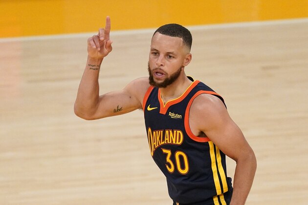 Golden State Warriors guard Stephen Curry gestures after scoring during the second half of an NBA basketball Western Conference Play-In game against the Los Angeles Lakers Wednesday, May 19, 2021, in Los Angeles. The Lakers won 103-100. (AP Photo/Mark J. Terrill)