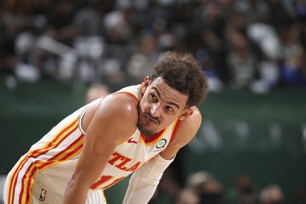MILWAUKEE, WI - JUNE 23: Trae Young #11 of the Atlanta Hawks looks on during the game against the Milwaukee Bucks during Game 1 of the Eastern Conference Finals of the 2021 NBA Playoffs on June 23, 2021 at the Fiserv Forum Center in Milwaukee, Wisconsin. NOTE TO USER: User expressly acknowledges and agrees that, by downloading and or using this Photograph, user is consenting to the terms and conditions of the Getty Images License Agreement. Mandatory Copyright Notice: Copyright 2021 NBAE (Photo by Gary Dineen/NBAE via Getty Images).