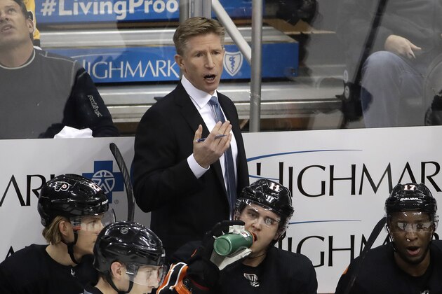 Philadelphia Flyers head coach Dave Hakstol gives instructions during the first period of an NHL hockey game against the Pittsburgh Penguins in Pittsburgh, Saturday, Dec. 1, 2018. The Flyers won 4-2. (AP Photo/Gene J. Puskar)