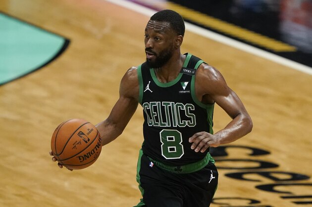 Boston Celtics guard Kemba Walker brings the ball down court against the Charlotte Hornets during the second half of an NBA basketball game on Sunday, April 25, 2021, in Charlotte, N.C. (AP Photo/Chris Carlson)