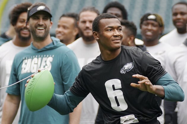 Philadelphia Eagles wide receiver DeVonta Smith (6) uses an elastic ball training aid as players and head coach Nick Sirianni look on during NFL football practice at Lincoln Financial Field, Friday, June 4, 2021, in Philadelphia. (Tim Tai/The Philadelphia Inquirer via AP, Pool)