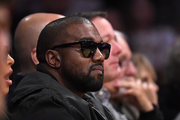 FILE - In this Jan. 13, 2020 file photo, Rapper Kanye West watches during the second half of an NBA basketball game between the Los Angeles Lakers and the Cleveland Cavaliers in Los Angeles. Drawings by WestÂ from when the rapper was a high school student in Chicago are now worth thousands of dollars, according to an appraiser. (AP Photo/Mark J. Terrill File)