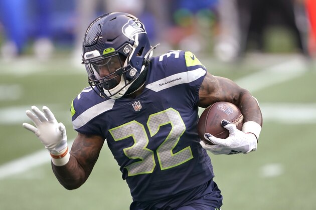 Seattle Seahawks running back Chris Carson in action against the Los Angeles Rams during the first half of an NFL wild-card playoff football game, Saturday, Jan. 9, 2021, in Seattle. (AP Photo/Ted S. Warren)