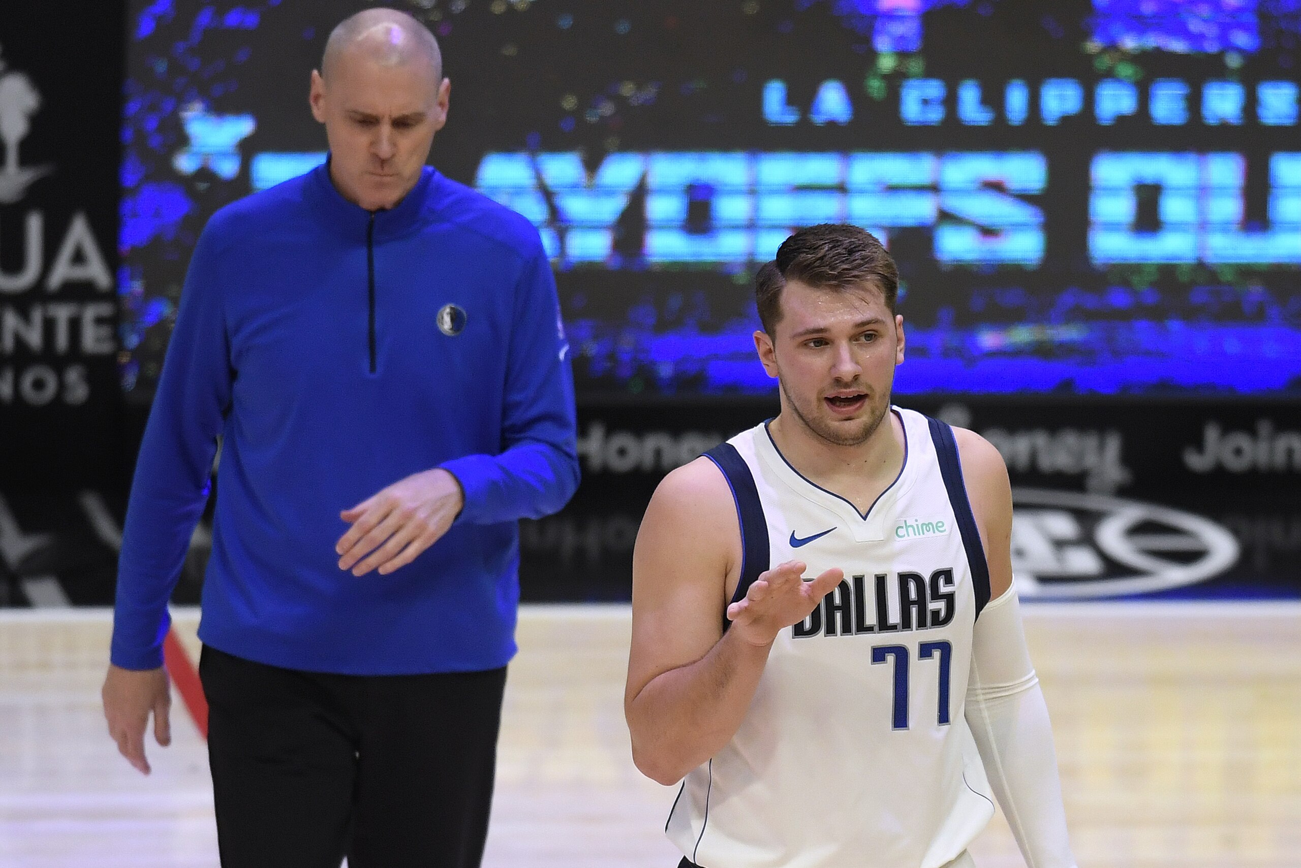 LOS ANGELES, CALIFORNIA - MAY 25: Luka Doncic #77 of the Dallas Mavericks #2 argues for a foul in front of head coach Rick Carlisle in the first quarter against the LA Clippers during game two of the Western Conference first round series at Staples Center on May 25, 2021 in Los Angeles, California. (Photo by Harry How/Getty Images) NOTE TO USER: User expressly acknowledges and agrees that, by downloading and or using this photograph, User is consenting to the terms and conditions of the Getty Images License Agreement. LOS ANGELES, CALIFORNIA - MAY 25: Luka Doncic #77 of the Dallas Mavericks #2 argues for a foul in front of head coach Rick Carlisle in the first quarter against the LA Clippers during game two of the Western Conference first round series at Staples Center on May 25, 2021 in Los Angeles, California. (Photo by Harry How/Getty Images) NOTE TO USER: User expressly acknowledges and agrees that, by downloading and or using this photograph, User is consenting to the terms and conditions of the Getty Images License Agreement.