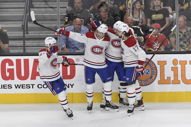 The Montreal Canadiens celebrate a goal by Montreal Canadiens center Jesperi Kotkaniemi, second left, during the first period in Game 5 of an NHL hockey Stanley Cup semifinal playoff series against the Vegas Golden Knights Tuesday, June 22, 2021, in Las Vegas. (AP Photo/David Becker)
