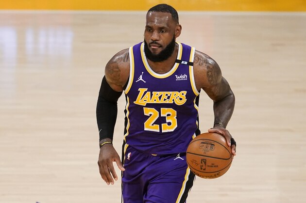 Los Angeles Lakers forward LeBron James dribbles during the first half of an NBA basketball game against the Sacramento Kings Friday, April 30, 2021, in Los Angeles. (AP Photo/Marcio Jose Sanchez)