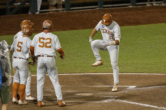 Texas's Ivan Melendez (17) stomps on home plate after hitting a home run also scoring Zach Zubia (52) and Mike Antico (5) against Mississippi State in the ninth inning during a baseball game in the College World Series Friday June 25, 2021, at TD Ameritrade Park in Omaha, Neb. (AP Photo/John Peterson)