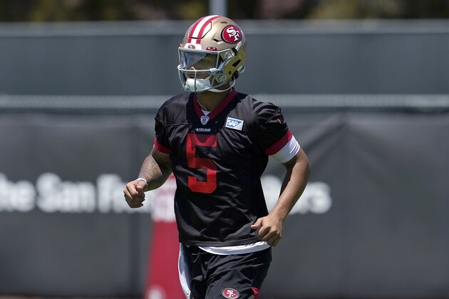 San Francisco 49ers quarterback Trey Lance jogs on the field at the team's NFL football training facility in Santa Clara, Calif., Tuesday, May 25, 2021. (AP Photo/Jeff Chiu)