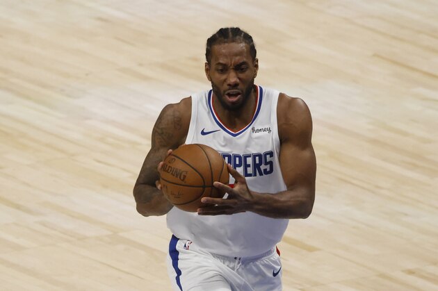 Los Angeles Clippers forward Kawhi Leonard (2) drives to the basket in the second half during Game 6 of an NBA basketball first-round playoff series in Dallas, Friday, June 4, 2021. (AP Photo/Michael Ainsworth)