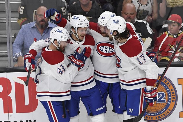 The Montreal Canadiens celebrate a goal by Montreal Canadiens center Jesperi Kotkaniemi, second left, during the first period in Game 5 of an NHL hockey Stanley Cup semifinal playoff series against the Vegas Golden Knights Tuesday, June 22, 2021, in Las Vegas. (AP Photo/David Becker)