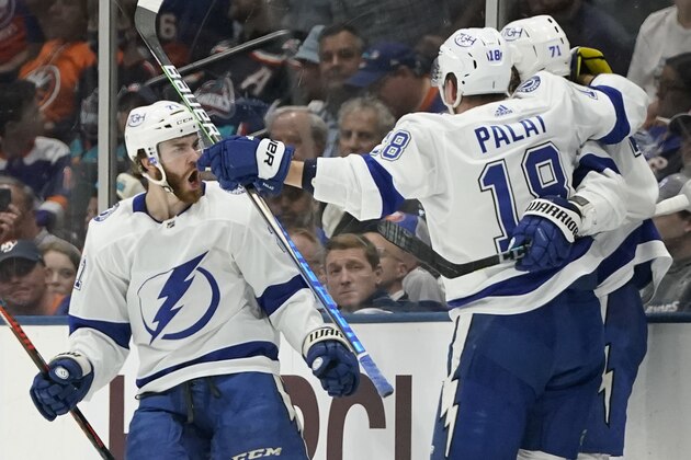 Tampa Bay Lightning Brayden Point, left, celebrates with teammates after a goal by center Anthony Cirelli (71) against the New York Islanders during the second period of Game 6 of the NHL hockey Stanley Cup semifinals, Wednesday, June 23, 2021, in Uniondale, N.Y. (AP Photo/Frank Franklin II)