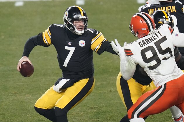 Pittsburgh Steelers quarterback Ben Roethlisberger (7) looks to pass under pressure by Cleveland Browns defensive end Myles Garrett (95) during the first half of an NFL wild-card playoff football game, Sunday, Jan. 10, 2021, in Pittsburgh. (AP Photo/Keith Srakocic)