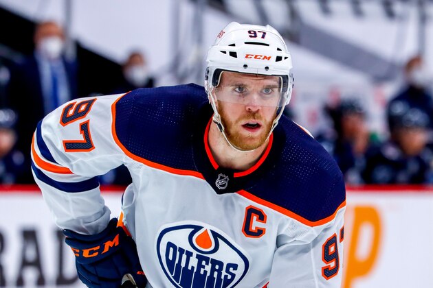 WINNIPEG, MB - MAY 24: Connor McDavid #97 of the Edmonton Oilers prepares for a second period face-off against the Winnipeg Jets in Game Four of the First Round of the 2021 Stanley Cup Playoffs at Bell MTS Place on May 24, 2021 in Winnipeg, Manitoba. (Photo by Darcy Finley/NHLI via Getty Images)