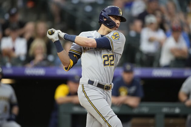 Milwaukee Brewers' Christian Yelich grounds out but drives in a run against Colorado Rockies pitcher Jhoulys Chacin during the third inning of a baseball game Saturday, June 19, 2021, in Denver. (AP Photo/David Zalubowski)
