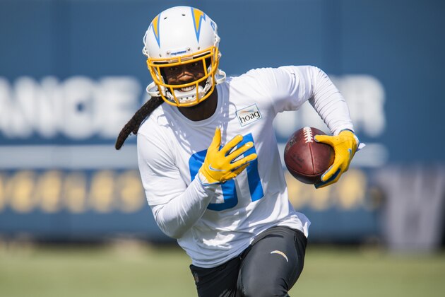 Los Angeles Chargers wide receiver Mike Williams (81) sprints with the ball during an NFL football practice Wednesday, June 16, 2021, in Costa Mesa, Calif. (AP Photo/Kyusung Gong)