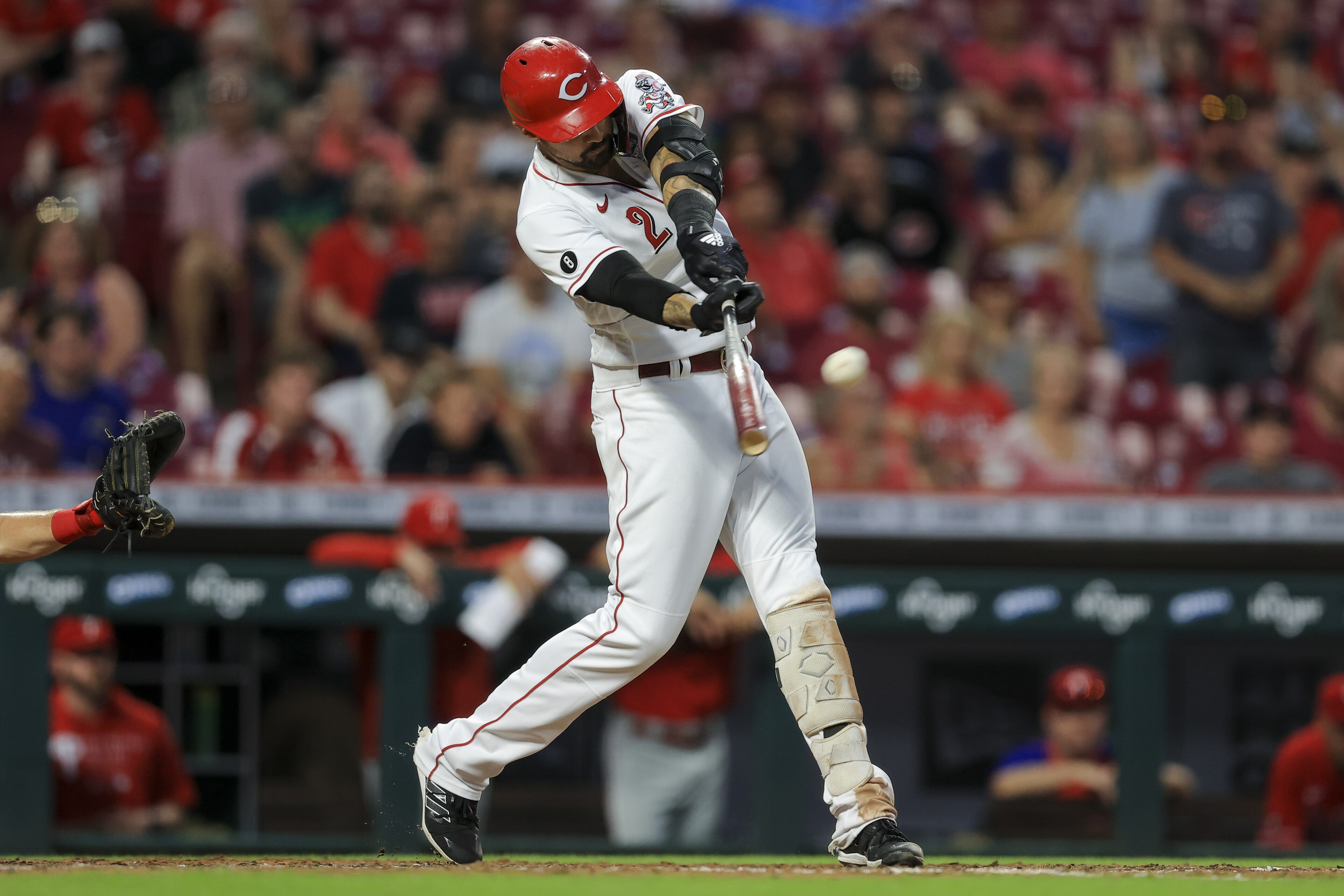 Cincinnati Reds' Nick Castellanos hits a grand slam during the seventh inning of a baseball game against the Philadelphia Phillies in Cincinnati, Monday, June 28, 2021. (AP Photo/Aaron Doster)