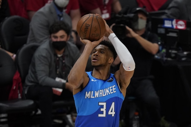Milwaukee Bucks' Giannis Antetokounmpo (34) shoots the ball against the Atlanta Hawks during the second half of Game 3 of the NBA Eastern Conference basketball finals Sunday, June 27, 2021, in Atlanta. (AP Photo/Brynn Anderson)