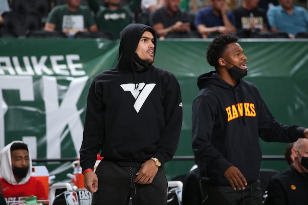 MILWAUKEE, WI - JULY 1: Trae Young #11 of the Atlanta Hawks looks on during Game 5 of the Eastern Conference Finals of the 2021 NBA Playoffs on July 1, 2021 at the Fiserv Forum Center in Milwaukee, Wisconsin. NOTE TO USER: User expressly acknowledges and agrees that, by downloading and or using this Photograph, user is consenting to the terms and conditions of the Getty Images License Agreement. Mandatory Copyright Notice: Copyright 2021 NBAE (Photo by Gary Dineen/NBAE via Getty Images).