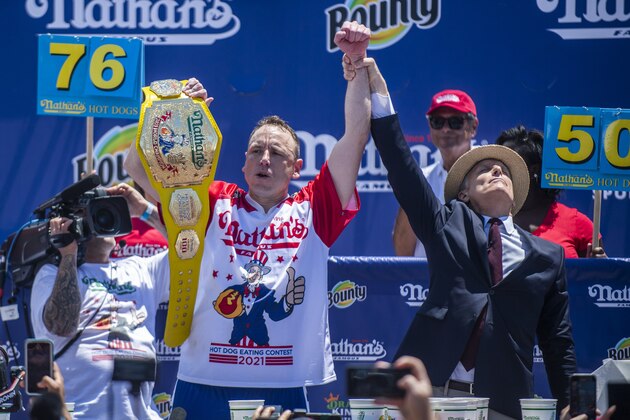 Chowdown champ Joey “Jaws” Chestnut celebrates after winning the the Nathan's Famous Fourth of July International Hot Dog-Eating Contest in Coney Island's Maimonides Park on Sunday, July 4, 2021, in the Brooklyn borough of New York. (AP Photo/Brittainy Newman)