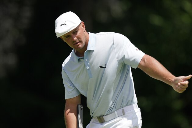 Bryson DeChambeau gestures as he putts on the ninth green during the second round of the Rocket Mortgage Classic golf tournament, Friday, July 2, 2021, at the Detroit Golf Club in Detroit. (AP Photo/Carlos Osorio)