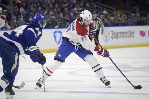Montreal Canadiens right wing Josh Anderson (17) controls the puck next to Tampa Bay Lightning defenseman Jan Rutta (44) during the first period in Game 2 of the NHL hockey Stanley Cup finals, Wednesday, June 30, 2021, in Tampa, Fla. (AP Photo/Phelan Ebenhack)