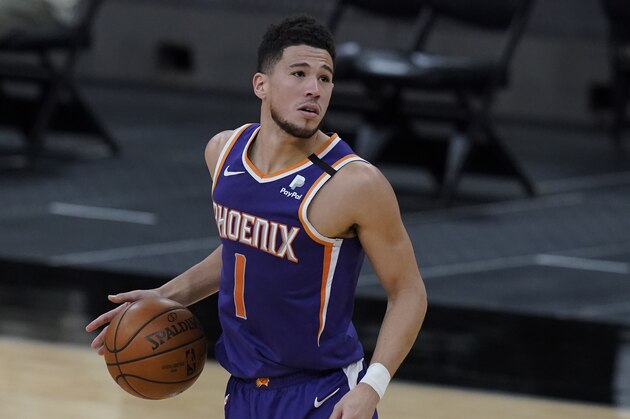 Phoenix Suns guard Devin Booker (1) during the first half of an NBA basketball game against the San Antonio Spurs in San Antonio, Saturday, May 15, 2021. (AP Photo/Eric Gay)