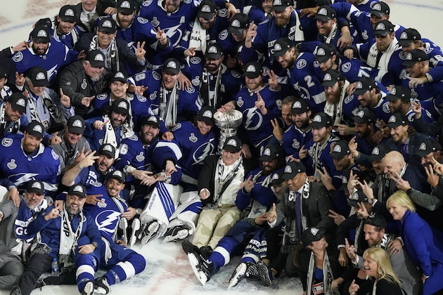 The Tampa Bay Lightning team poses with the Stanley Cup after Game 5 of the NHL hockey Stanley Cup finals against the Montreal Canadiens, Wednesday, July 7, 2021, in Tampa, Fla. (AP Photo/Gerry Broome) The Tampa Bay Lightning team poses with the Stanley Cup after Game 5 of the NHL hockey Stanley Cup finals against the Montreal Canadiens, Wednesday, July 7, 2021, in Tampa, Fla. (AP Photo/Gerry Broome)