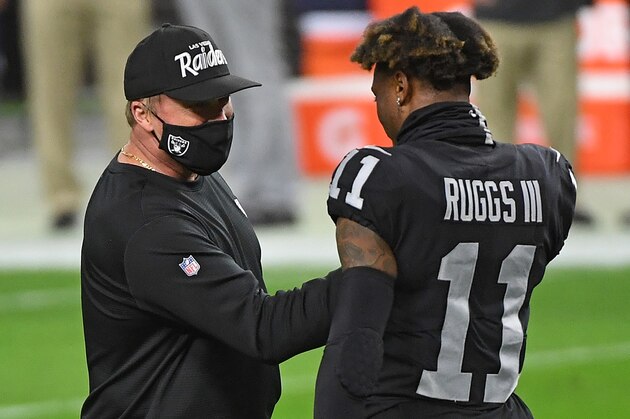 LAS VEGAS, NEVADA - DECEMBER 26:  Head coach Jon Gruden of the Las Vegas Raiders speaks with Henry Ruggs III #11 prior to a game against the Miami Dolphins at Allegiant Stadium on December 26, 2020 in Las Vegas, Nevada. (Photo by Ethan Miller/Getty Images)
