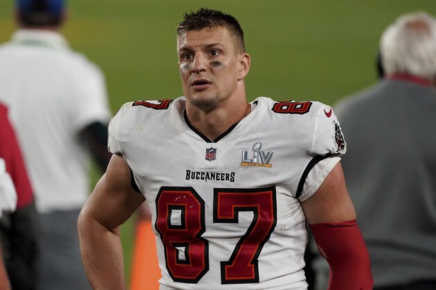 Tampa Bay Buccaneers tight end Rob Gronkowski (87) looks out towards the crowd from the sideline during the second half of the NFL Super Bowl 55 football game against the Kansas City Chiefs, Sunday, Feb. 7, 2021, in Tampa, Fla. The Tampa Bay Buccaneers defeated the Kansas City Chiefs 31-9. (AP Photo/Steve Luciano)