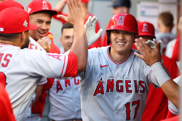 SEATTLE, WASHINGTON - JULY 09: Shohei Ohtani #17 of the Los Angeles Angels celebrates in the dugout after hitting a solo home run during the third inning against the Seattle Mariners at T-Mobile Park on July 09, 2021 in Seattle, Washington. (Photo by Abbie Parr/Getty Images)