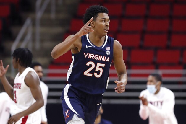 Virginia's Trey Murphy III (25) heads back down court after scoring during the second half of Virginia's 64-57 victory over North Carolina State in an NCAA college basketball game Wednesday, Feb. 3, 2021, in Raleigh, N.C. (Ethan Hyman/The News & Observer via AP, Pool)