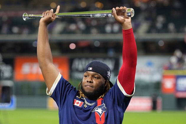 American League's Vladimir Guerrero Jr., of the Toronto Blue Jays, holds the MVP trophy after the MLB All-Star baseball game, Tuesday, July 13, 2021, in Denver. (AP Photo/Jack Dempsey)