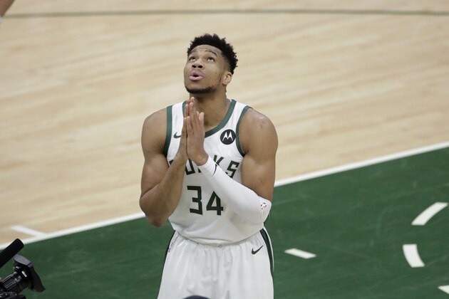 Milwaukee Bucks forward Giannis Antetokounmpo (34) reacts before the start of Game 4 of basketball's NBA Finals against the Phoenix Suns, Wednesday, July 14, 2021, in Milwaukee. (AP Photo/Aaron Gash)