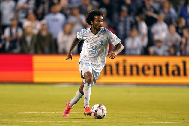 Sporting Kansas City forward Gianluca Busio dribbles the ball during the second half of an MLS soccer match against the Houston Dynamo Saturday, May 29, 2021, in Kansas City, Kan. Kansas City won 3-1. (AP Photo/Charlie Riedel)