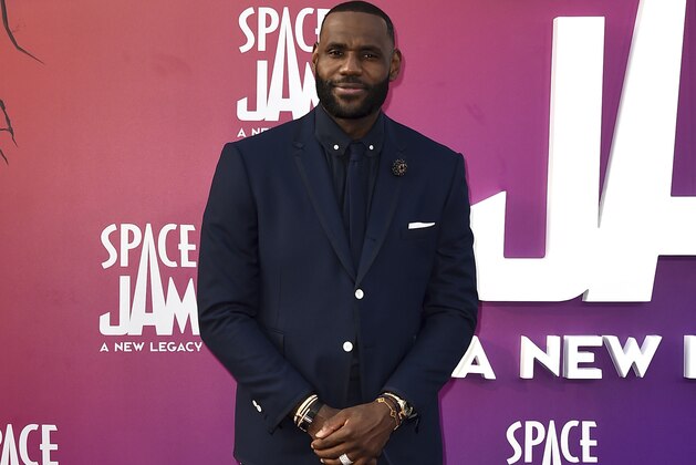 NBA basketball player LeBron James, of the Los Angeles Lakers, arrives at the world premiere of