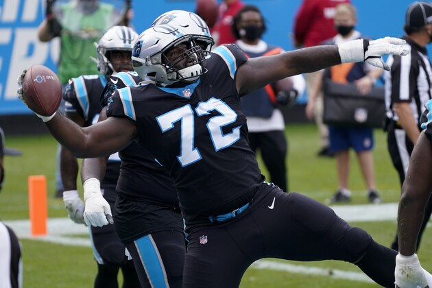 Carolina Panthers offensive tackle Taylor Moton celebrates during the first half of an NFL football game against the Detroit Lions Sunday, Nov. 22, 2020, in Charlotte, N.C. (AP Photo/Gerry Broome)