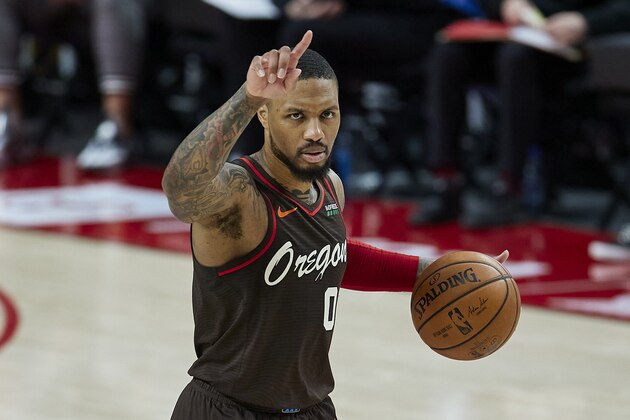 Portland Trail Blazers guard Damian Lillard brings the ball up court against the Golden State Warriors during the second half of an NBA basketball game in Portland, Ore., Wednesday, March 3, 2021. (AP Photo/Craig Mitchelldyer)