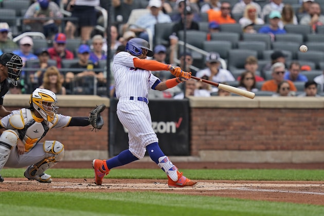 New York Mets' Francisco Lindor hits a two-run home run during the first inning of a baseball game against the Pittsburgh Pirates at Citi Field, Sunday, July 11, 2021, in New York. (AP Photo/Seth Wenig)